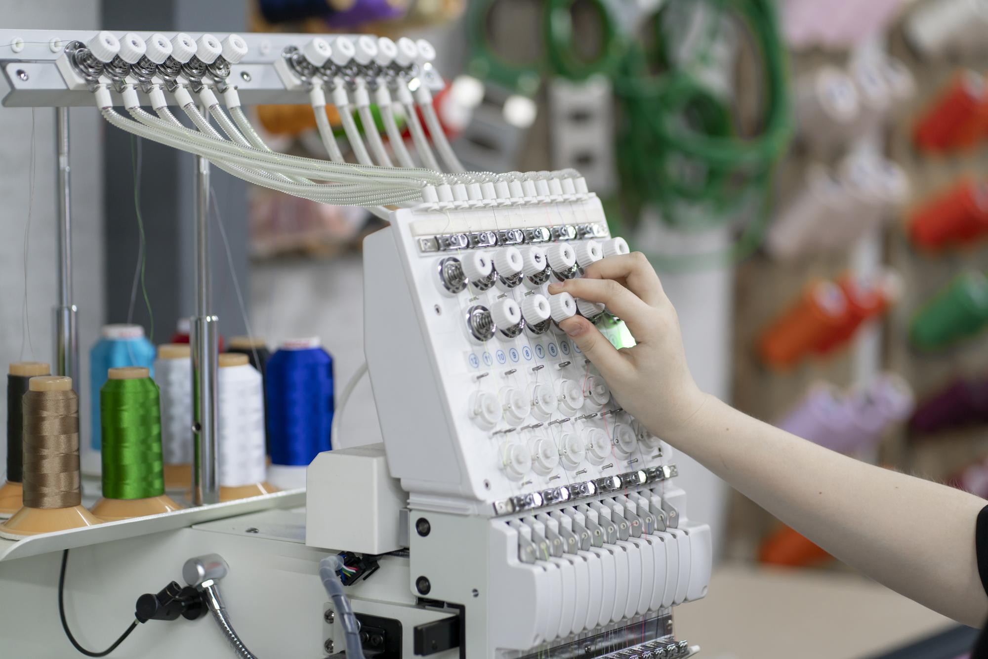 modern embroidery workshop with machines and samples